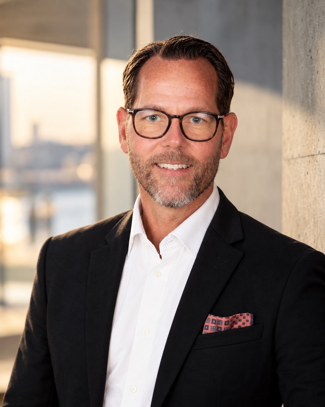 John Björksten wearing a dark jacket and white shirt